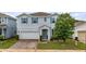 Charming two-story home with brick paver driveway, two car garage and beautifully landscaped front yard at 3235 Buoy Cir, Winter Garden, FL 34787