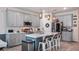 Kitchen featuring stainless steel appliances, gray cabinets and a white countertop island with seating at 3235 Buoy Cir, Winter Garden, FL 34787