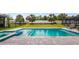 Beautiful pool with spa, steps, and a tanning ledge surrounded by a landscaped backyard at 3235 Buoy Cir, Winter Garden, FL 34787