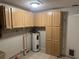 Basement features a water heater and plenty of cabinets for storage at 32737 Vista Ave, Leesburg, FL 34788