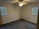 Cozy bedroom featuring neutral paint, plush carpeting, and great natural light at 32737 Vista Ave, Leesburg, FL 34788