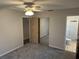 Bedroom including an en-suite bathroom, large closet and new carpet at 32737 Vista Ave, Leesburg, FL 34788