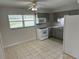 Clean kitchen with neutral cabinets, tile flooring and appliances included at 32737 Vista Ave, Leesburg, FL 34788