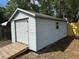 Storage shed offers plenty of space for tools and equipment in backyard at 32737 Vista Ave, Leesburg, FL 34788
