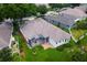 Aerial view of the house shows screened patio and nice landscaping at 33222 Irongate Dr, Leesburg, FL 34788