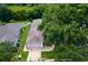 Aerial shot of a home with mature trees and a well-maintained lawn at 33222 Irongate Dr, Leesburg, FL 34788