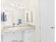 Bright bathroom with a single vanity, granite countertop, decorative lighting, and a mirrored medicine cabinet at 33222 Irongate Dr, Leesburg, FL 34788