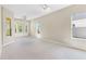 Expansive bedroom featuring multiple windows, a ceiling fan, neutral walls, and plush carpeting at 33222 Irongate Dr, Leesburg, FL 34788