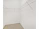 A walk-in closet with a wire shelving system and neutral carpeting at 33222 Irongate Dr, Leesburg, FL 34788