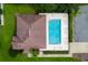 Overhead view of community pool with lounge chairs and well-maintained grounds at 33222 Irongate Dr, Leesburg, FL 34788