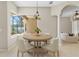 Cozy breakfast nook offering natural light and serene views of the pool area at 33222 Irongate Dr, Leesburg, FL 34788