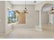 Dining room showcases tile flooring, column accents, and views of the lanai at 33222 Irongate Dr, Leesburg, FL 34788