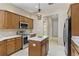 Updated kitchen featuring stainless steel appliances and a central island at 33222 Irongate Dr, Leesburg, FL 34788