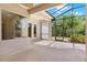 Screened lanai featuring ceiling fan and views of the backyard at 33222 Irongate Dr, Leesburg, FL 34788