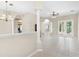 Open-concept living space featuring tile floors, neutral walls, and abundant natural light at 33222 Irongate Dr, Leesburg, FL 34788