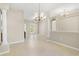 Spacious living room features tile flooring, decorative columns, and open layout at 33222 Irongate Dr, Leesburg, FL 34788