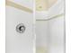 Modern shower showcasing clean lines and white tile with decorative trim at 33222 Irongate Dr, Leesburg, FL 34788
