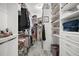 Large walk-in closet with custom shelving and hardwood floors at 3354 Truluck Pl, Oxford, FL 34484
