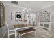 Cozy dining room showcasing a chandelier, decorative mirror, and stylish furnishings at 3354 Truluck Pl, Oxford, FL 34484