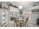 Cozy dining area with pool views, hardwood floors, and stylish chandelier at 3354 Truluck Pl, Oxford, FL 34484