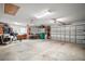 Spacious garage with high ceilings, a fan, and storage solutions, ready for a variety of uses and projects at 3354 Truluck Pl, Oxford, FL 34484