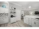 Bright kitchen boasts white cabinets, stainless appliances, and hardwood floors at 3354 Truluck Pl, Oxford, FL 34484