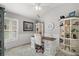 Bright office features a distressed wood desk, custom shelving, and an abundance of natural light at 3354 Truluck Pl, Oxford, FL 34484