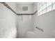 Walk-in shower with a tile design, built in seat, and a rainfall showerhead at 3354 Truluck Pl, Oxford, FL 34484