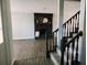 Beautiful Living Room with black rock fireplace and staircase at 33710 Linda Ln, Leesburg, FL 34748