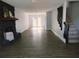 Spacious living room featuring a black rock fireplace and modern flooring at 33710 Linda Ln, Leesburg, FL 34748