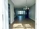 Open floor plan with modern flooring and chandelier lighting at 33710 Linda Ln, Leesburg, FL 34748