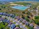 A picturesque aerial view of a suburban neighborhood showcasing the proximity to water reservoirs at 34107 Alameda Dr, Sorrento, FL 32776