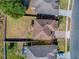 Aerial view shows the roof, yard, and the proximity to neighbors at 34107 Alameda Dr, Sorrento, FL 32776
