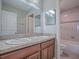 Bathroom boasts double sinks and a full bathtub with shower at 34107 Alameda Dr, Sorrento, FL 32776