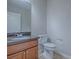 Half bath with granite countertop and wood vanity at 34107 Alameda Dr, Sorrento, FL 32776