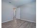 Bedroom with neutral paint, modern flooring, and an open doorway at 34107 Alameda Dr, Sorrento, FL 32776