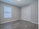 Bright bedroom features a double door closet and large window at 34107 Alameda Dr, Sorrento, FL 32776