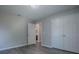 Bedroom with double door closet and ensuite bathroom at 34107 Alameda Dr, Sorrento, FL 32776