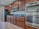A kitchen view with stainless steel appliances and dark wood cabinetry at 34107 Alameda Dr, Sorrento, FL 32776