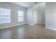 A spacious living room with neutral paint, tile flooring, and ample natural light is perfect for entertaining at 34107 Alameda Dr, Sorrento, FL 32776