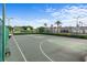 Exterior basketball court with green surface, basketball hoops and court lines at 3440 Tumbling River Dr, Clermont, FL 34711