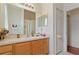 Bright bathroom features a double vanity, large mirror, and a separate toilet and shower room at 3440 Tumbling River Dr, Clermont, FL 34711