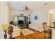 Living room with wood floors, ceiling fan, and sliding windows at 3440 Tumbling River Dr, Clermont, FL 34711