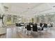 Brightly lit meeting room with large windows, tables and chairs at 3440 Tumbling River Dr, Clermont, FL 34711