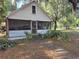 Charming home with a covered porch and mature landscaping offering a peaceful curb appeal at 350 Cassady St, Umatilla, FL 32784