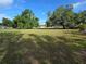 Expansive land parcel adorned with mature trees and lush greenery at 350 Cassady St, Umatilla, FL 32784