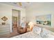Bright bedroom features a seaside themed bedspread and decor at 3800 Woodleaf Ct, Leesburg, FL 34748