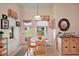 Charming breakfast nook with natural light, comfortable seating, and convenient access to the outdoors at 3800 Woodleaf Ct, Leesburg, FL 34748