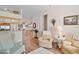 Open living room with easy access to the kitchen, showcasing hardwood floors, and comfortable seating at 3800 Woodleaf Ct, Leesburg, FL 34748