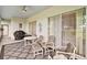 Relaxing screened patio with stylish furniture, perfect for enjoying the outdoors at 3800 Woodleaf Ct, Leesburg, FL 34748